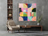 Cuadro Bauhaus geométrico vibrante, 120x120 cm, enmarcado en madera natural. Arte abstracto moderno para salón o estudio creativo.