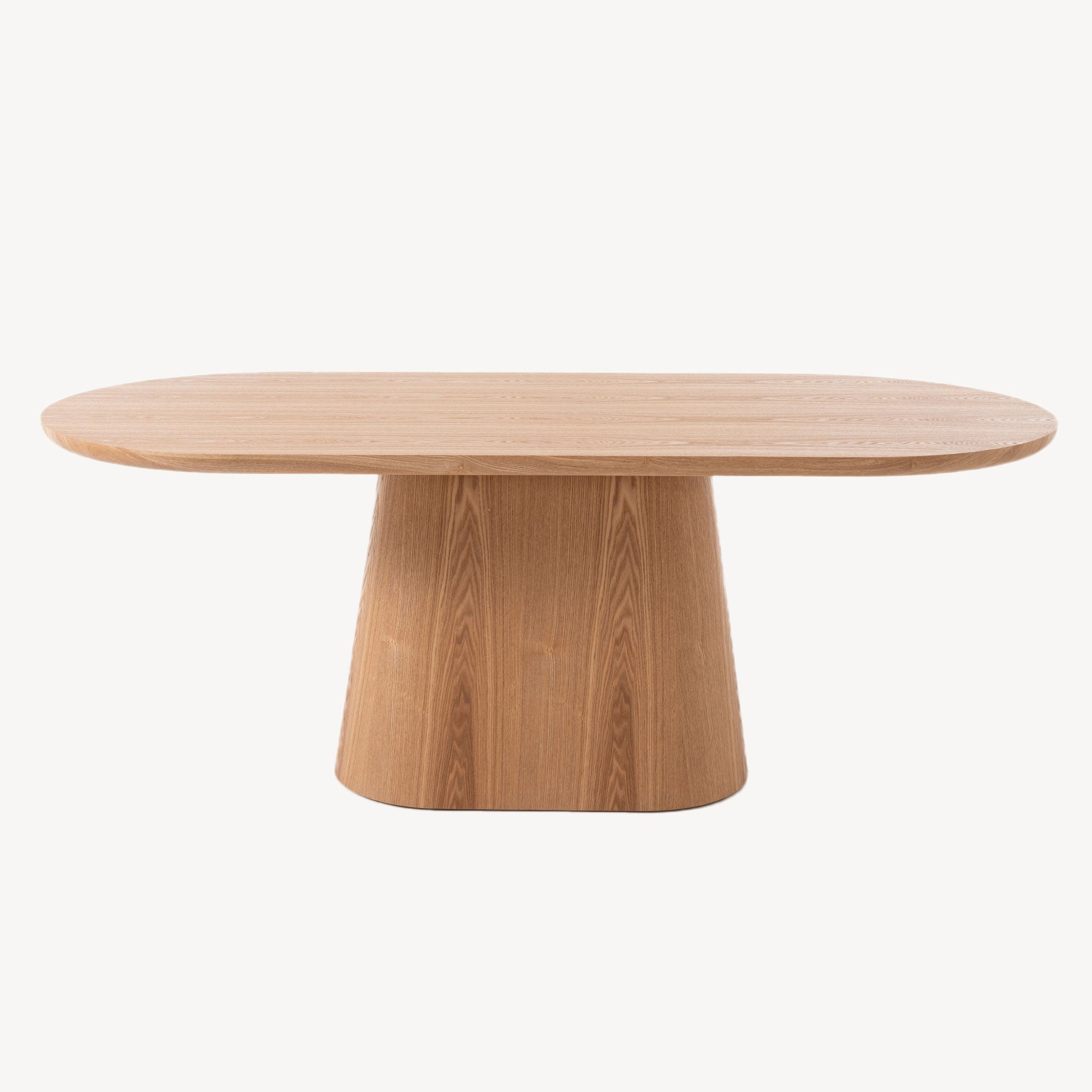 Mesa fija Savia de diseño orgánico, tapa ovalada y base troncocónica en madera de roble natural. Ideal para comedor moderno, nórdico o rústico.